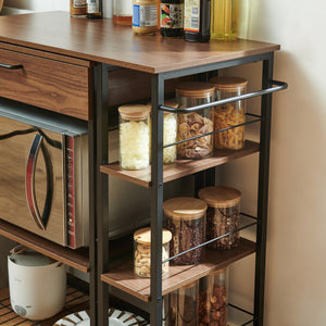 Estante de cocina extensible Kirhuskyna 130x40x85 cm aspecto nogal/negro [en.casa]