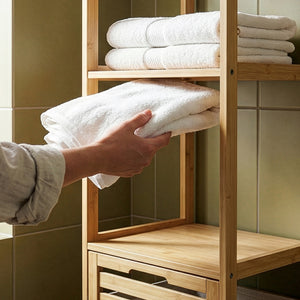 Badregal mit Wäschesammler Anun 130x36x33 cm Bambus Holzfarben [en.casa]